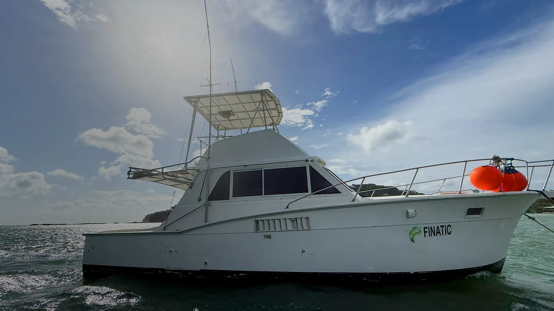 rods hanging from fishing charter